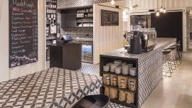 Old armored vehicle hangar transformed into a new market hall